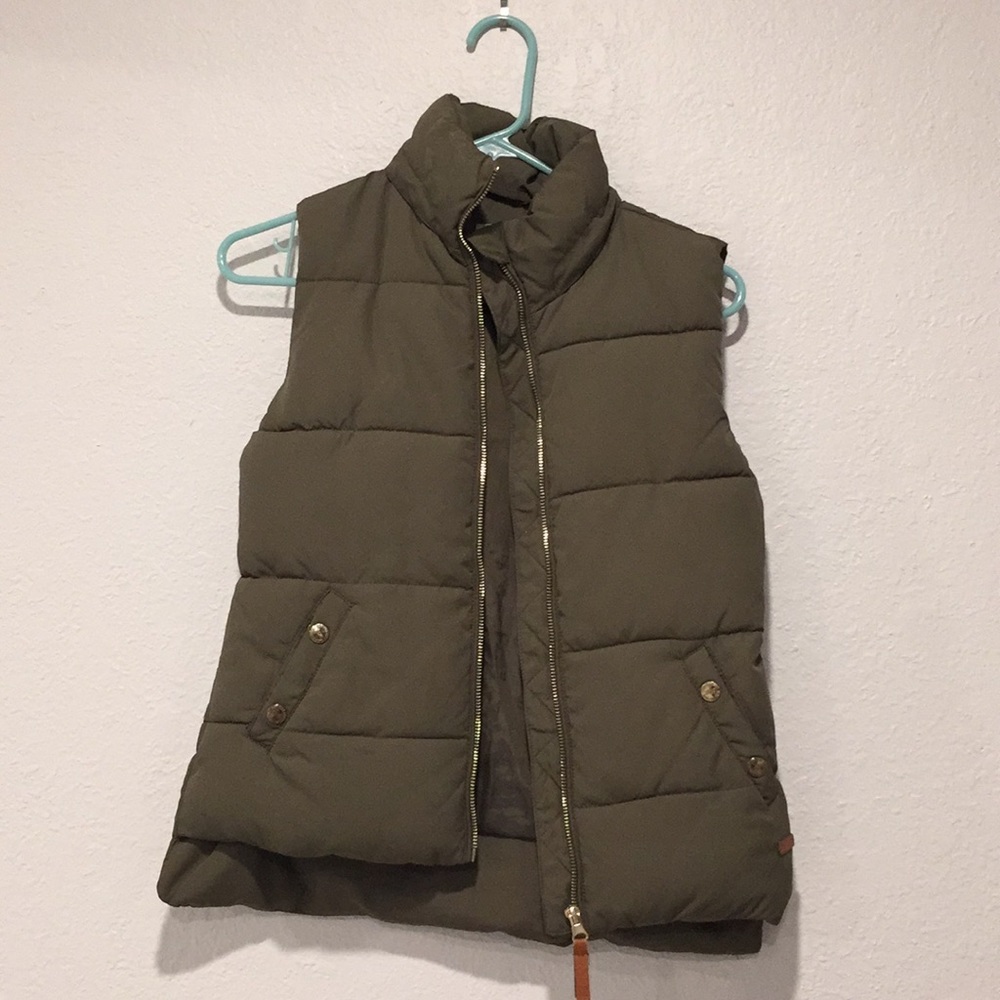 Olive green vest.